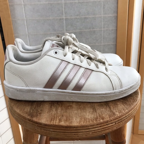 white sneakers with gold stripes